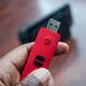 Illustration for article titled This Red Little Devil of a USB Stick Allows Any Controller on Nintendo Switch and Makes iPokémon Sword/i iand Shield /iTen Times Easier